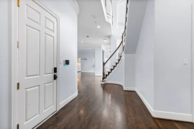 a view of entryway with wooden floor