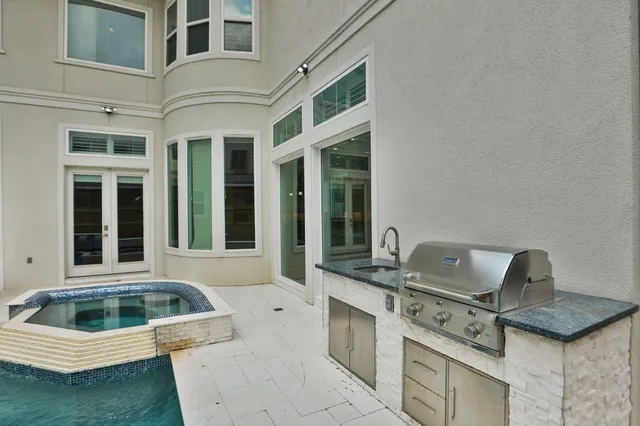 a white house with a sink and dishwasher