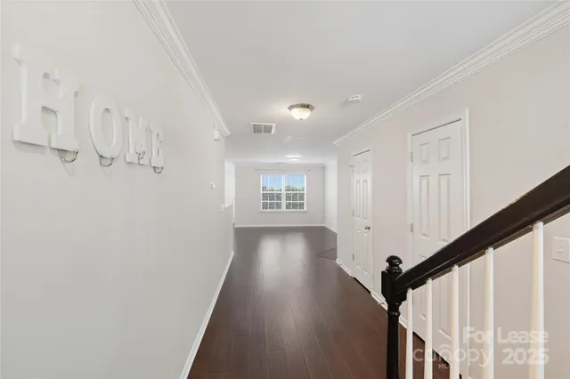 a view of entryway with wooden floor
