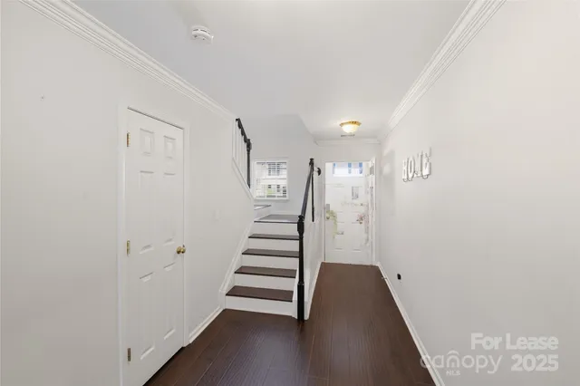 a view of entryway with wooden floor