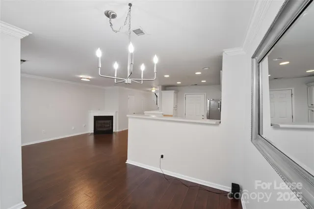 a view of a kitchen with marble kitchen and kitchen island