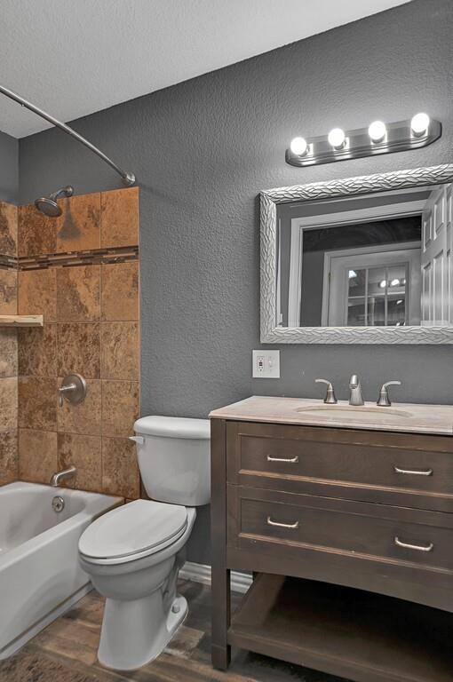 5004 Gholson Road Waco, TX 76705 - Photo 33 of 40 a bathroom with a sink a toilet and a mirror