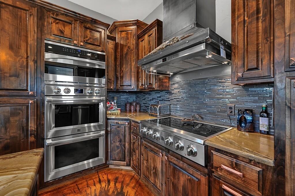 5004 Gholson Road Waco, TX 76705 - Photo 9 of 40 a kitchen with granite countertop a stove and a microwave