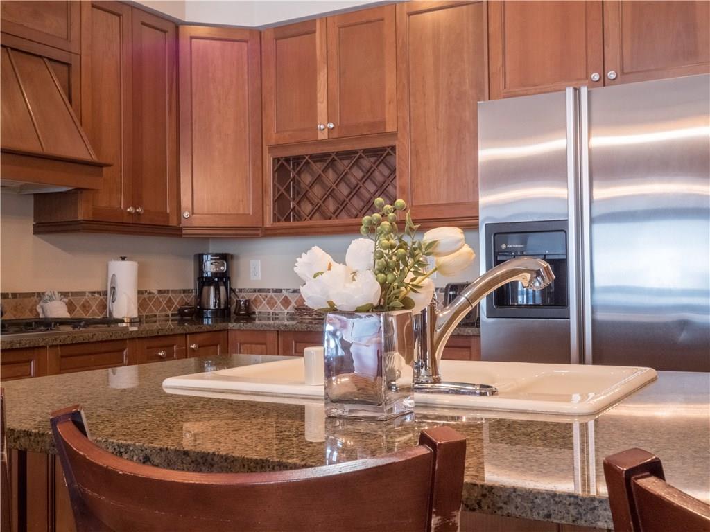 280 Trailhead Drive, Unit 3020 Keystone, CO 80435 - Photo 2 of 24 a kitchen with a refrigerator and cabinets