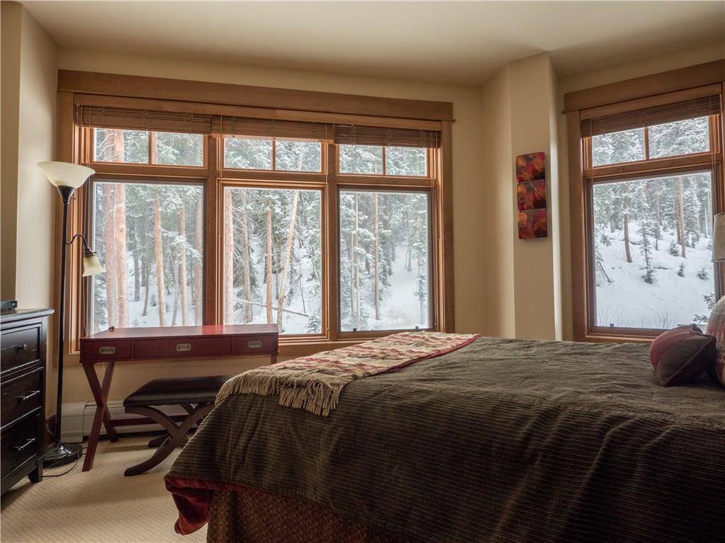 280 Trailhead Drive, Unit 3020 Keystone, CO 80435 - Photo 11 of 24 a bed sitting in a bedroom next to a window