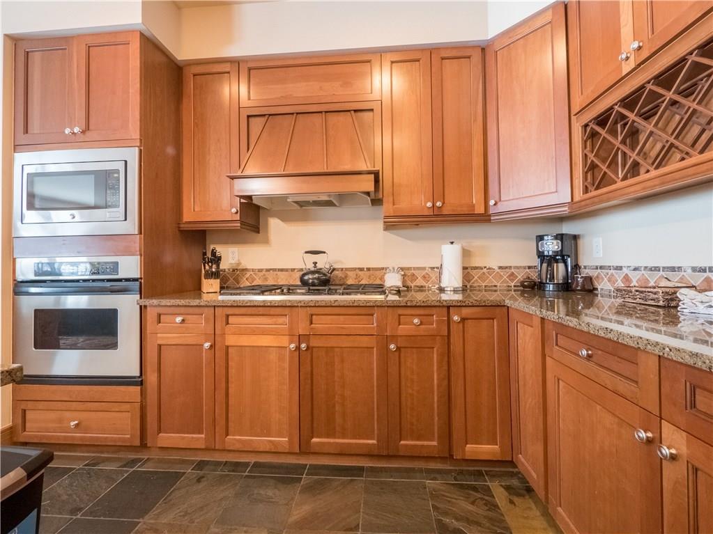 280 Trailhead Drive, Unit 3020 Keystone, CO 80435 - Photo 18 of 24 a kitchen with stainless steel appliances granite countertop a refrigerator and cabinets