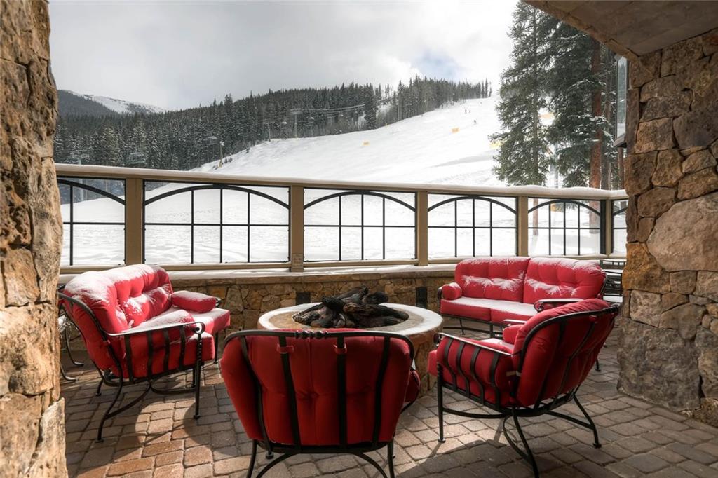 280 Trailhead Drive, Unit 3020 Keystone, CO 80435 - Photo 21 of 24 a roof deck with a table and chairs