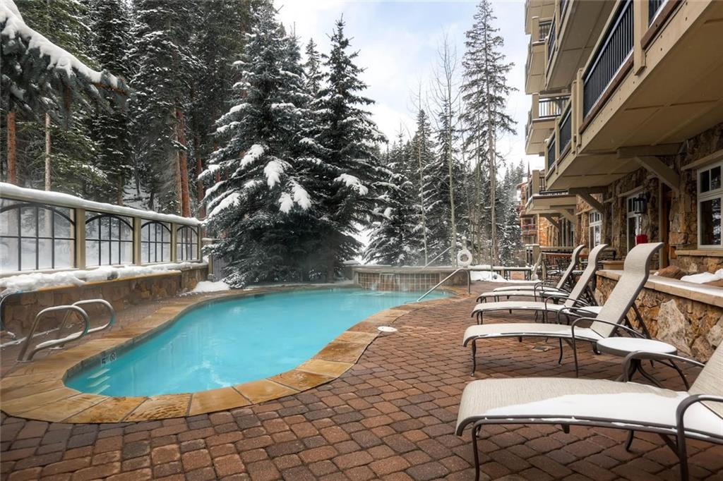 280 Trailhead Drive, Unit 3020 Keystone, CO 80435 - Photo 22 of 24 a view of a swimming pool with lounge chair