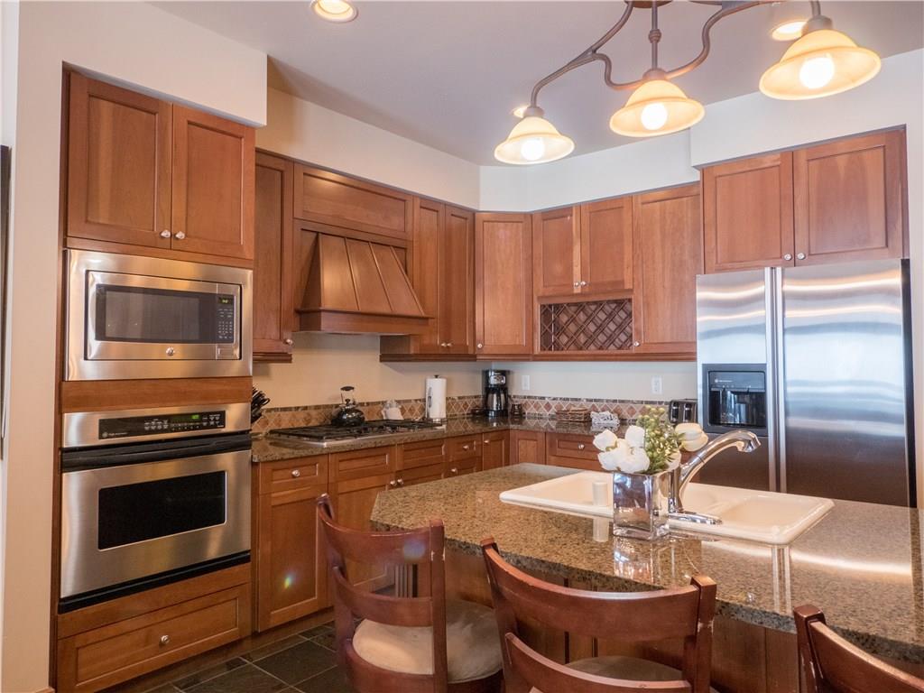 280 Trailhead Drive, Unit 3020 Keystone, CO 80435 - Photo 24 of 24 a kitchen with a stove a sink and cabinets