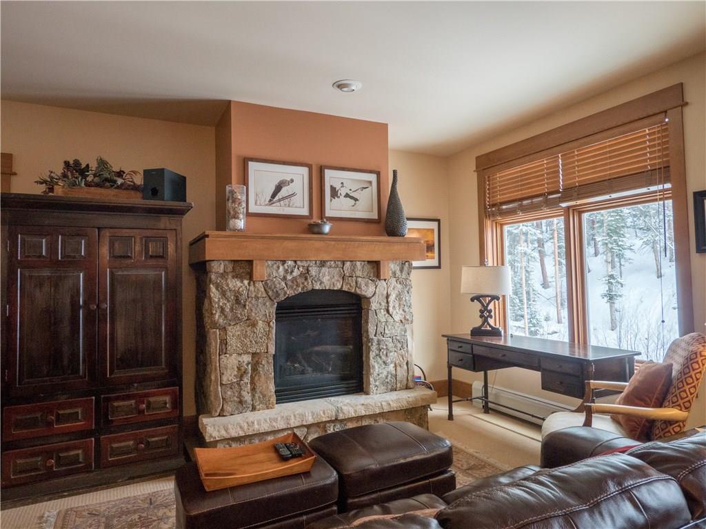 280 Trailhead Drive, Unit 3020 Keystone, CO 80435 - Photo 4 of 24 a living room with furniture and a fireplace