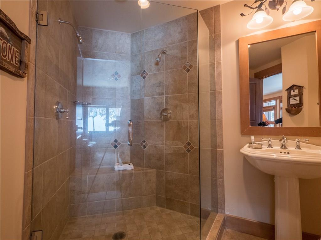 280 Trailhead Drive, Unit 3020 Keystone, CO 80435 - Photo 5 of 24 a bathroom with a shower a sink and a mirror