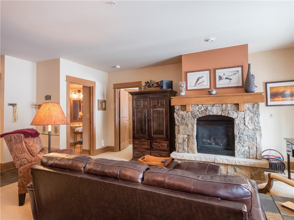 280 Trailhead Drive, Unit 3020 Keystone, CO 80435 - Photo 9 of 24 a living room with fireplace furniture and a fireplace