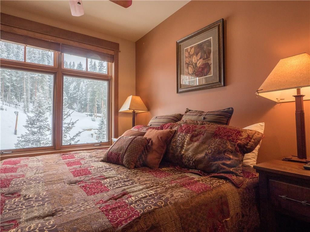 280 Trailhead Drive, Unit 3020 Keystone, CO 80435 - Photo 10 of 24 a bed sitting in a bedroom next to a window