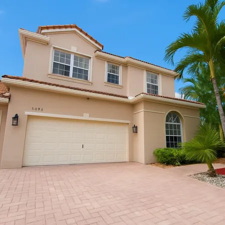 a front view of a house with a garage