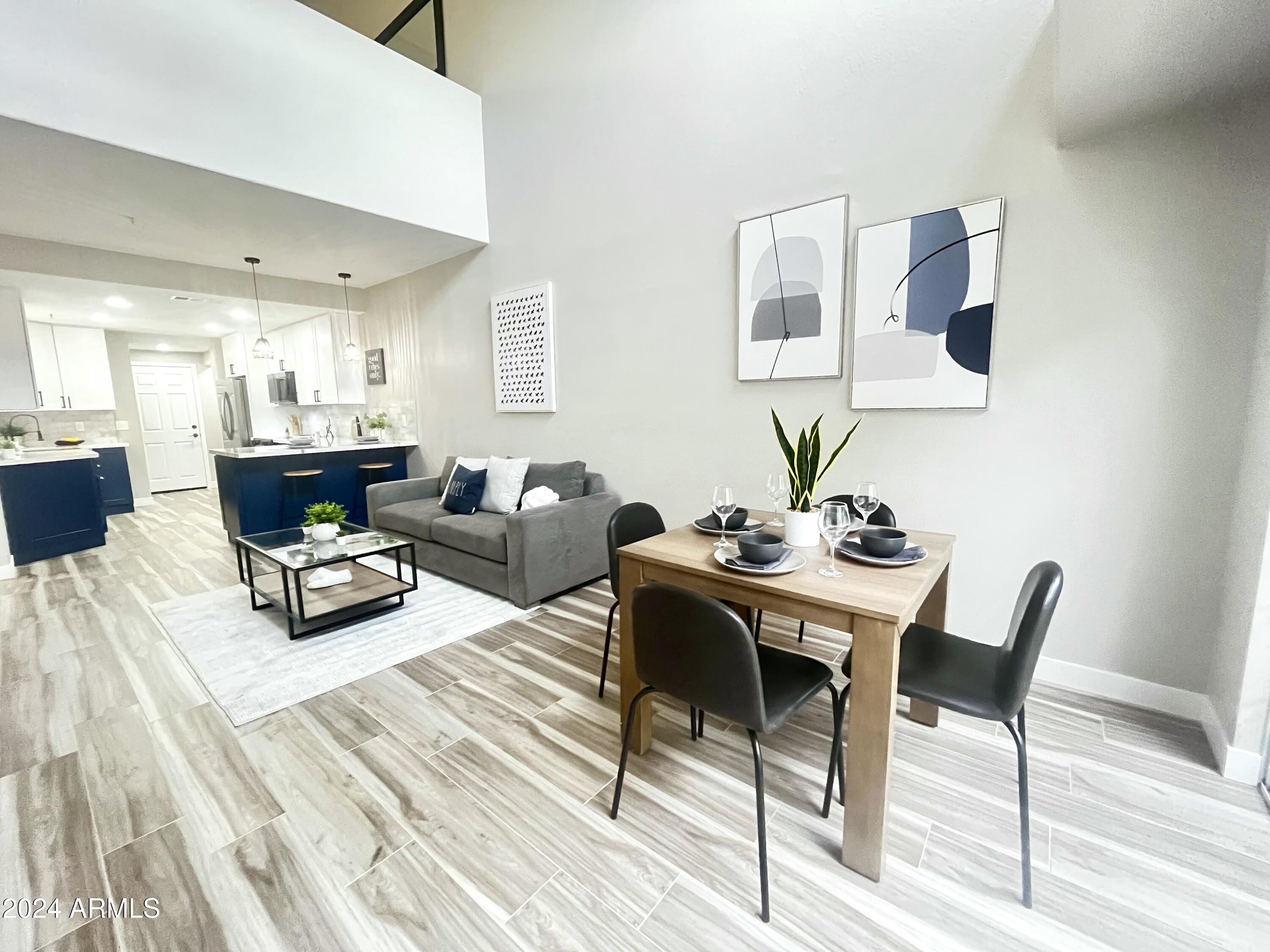 7710 East Gainey Ranch Road, Unit 137 Scottsdale, AZ 85258 - Photo 18 of 56 a living room with furniture and a table