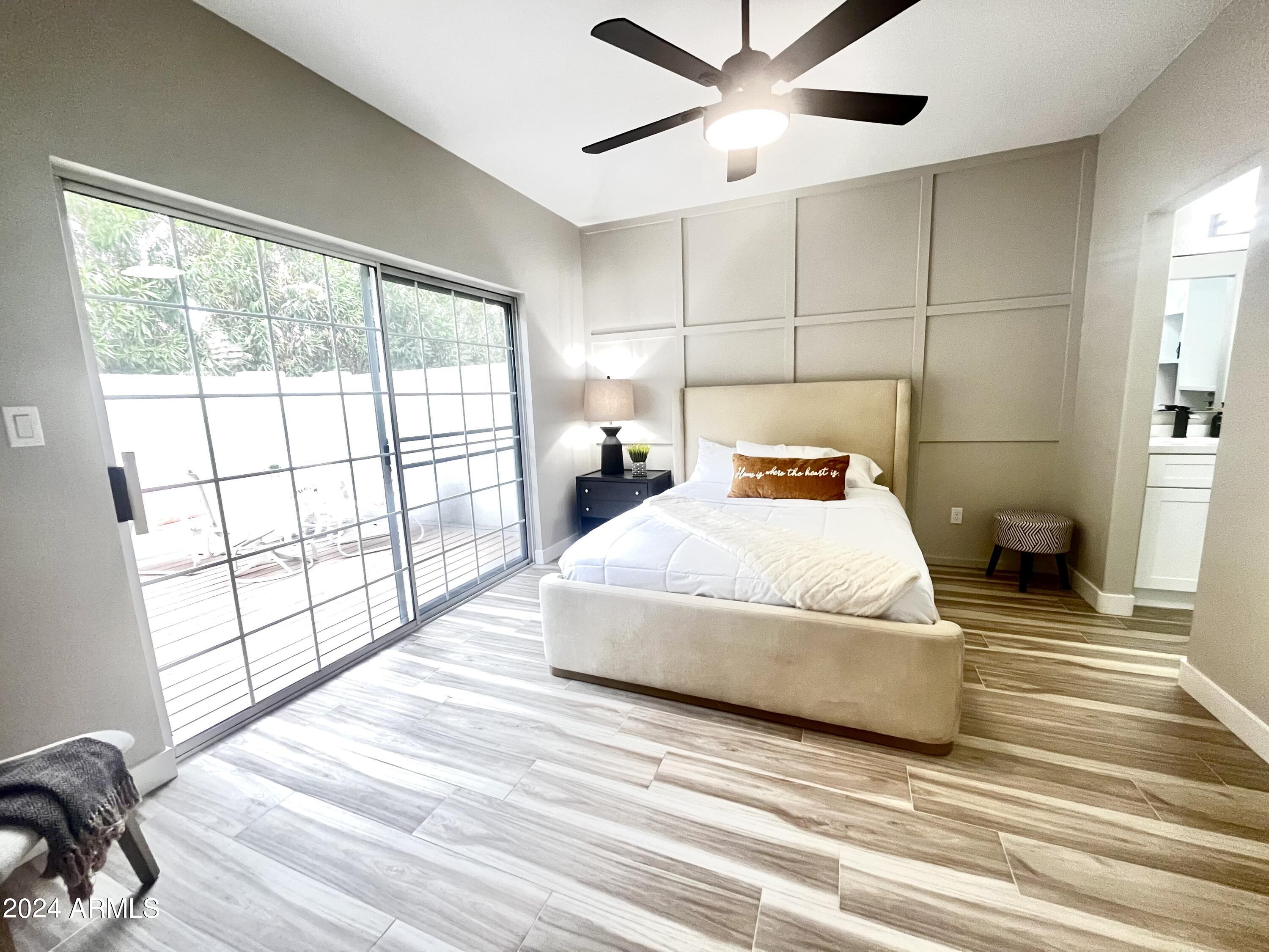 7710 East Gainey Ranch Road, Unit 137 Scottsdale, AZ 85258 - Photo 22 of 56 a bedroom with a bed and window