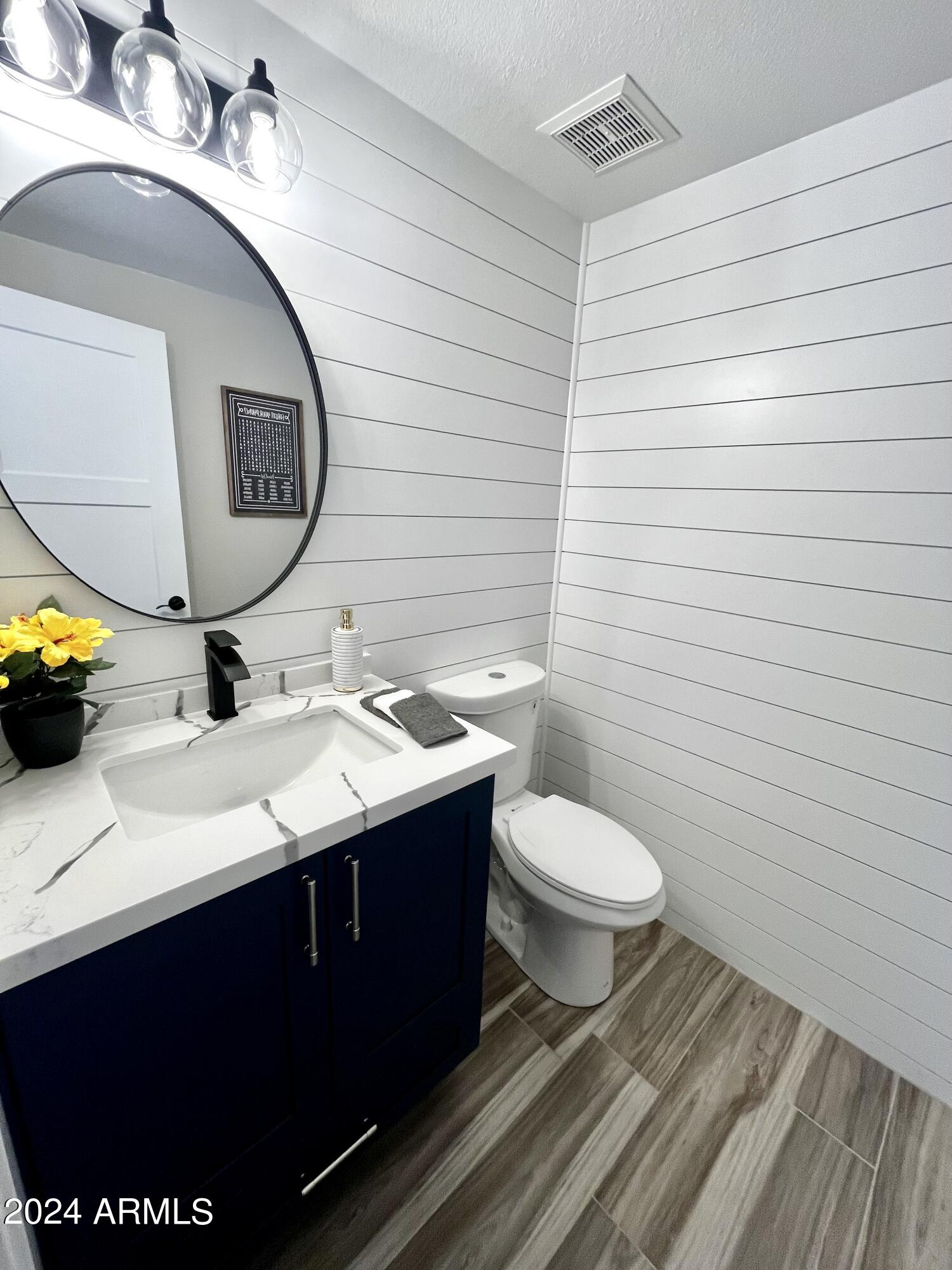 7710 East Gainey Ranch Road, Unit 137 Scottsdale, AZ 85258 - Photo 29 of 56 a bathroom with a sink and a mirror