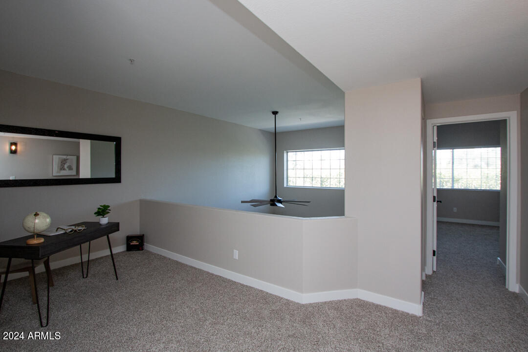7710 East Gainey Ranch Road, Unit 137 Scottsdale, AZ 85258 - Photo 31 of 56 a view of a livingroom with furniture and windows