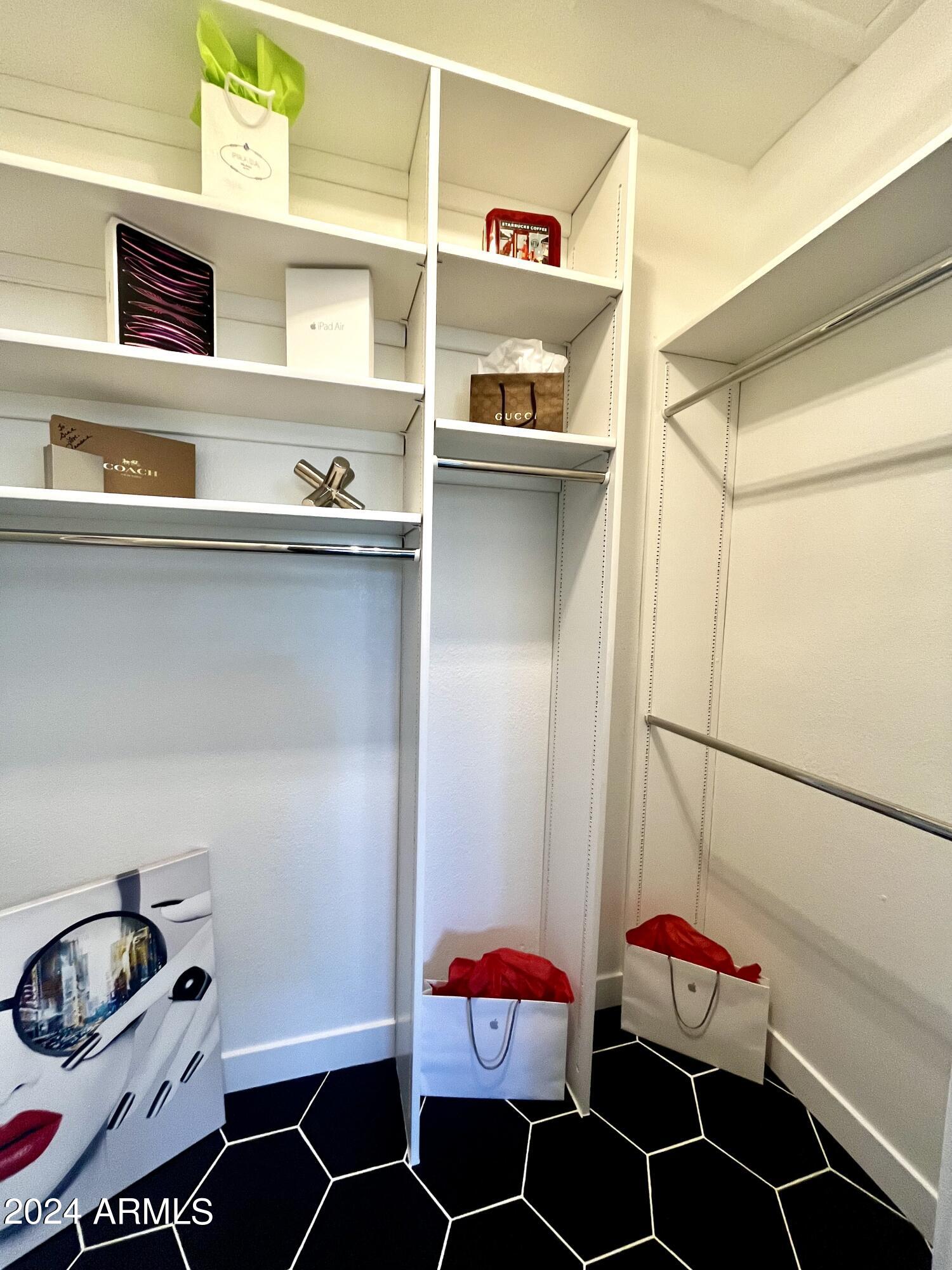 7710 East Gainey Ranch Road, Unit 137 Scottsdale, AZ 85258 - Photo 37 of 56 Upstairs Walk-in Closet