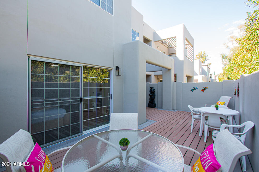 7710 East Gainey Ranch Road, Unit 137 Scottsdale, AZ 85258 - Photo 38 of 56 a view of livingroom and dining room with furniture wooden floor and a potted plant