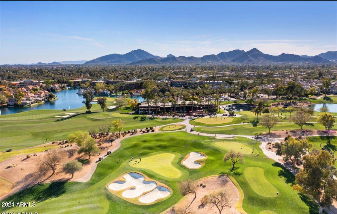 7710 East Gainey Ranch Road, Unit 137 Scottsdale, AZ 85258 - Photo 51 of 56 a view of a town with swimming pool