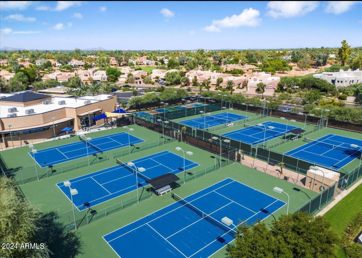 7710 East Gainey Ranch Road, Unit 137 Scottsdale, AZ 85258 - Photo 53 of 56 an aerial view of a pool yard and mountain view