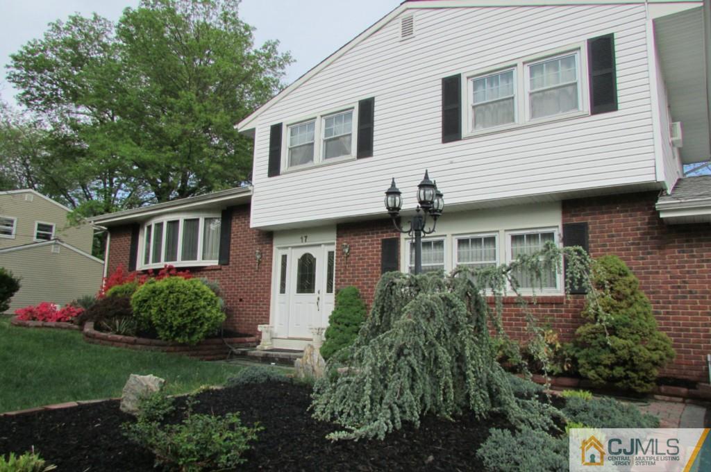 17 Gage Road East Brunswick, NJ 08816 - Photo 2 of 24 a front view of a house with a garden