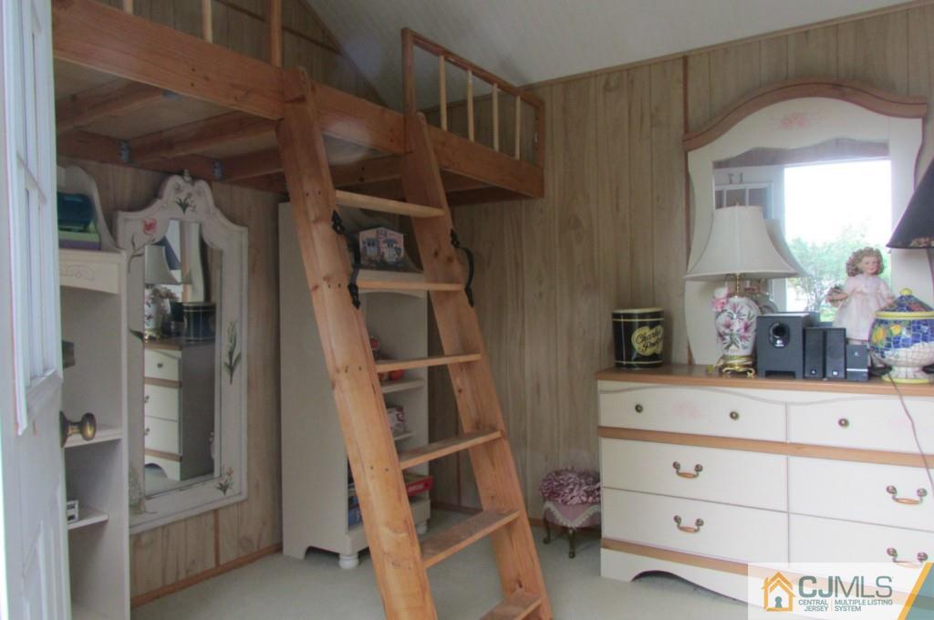 17 Gage Road East Brunswick, NJ 08816 - Photo 11 of 24 a view of walk in closet with clothes and shoes