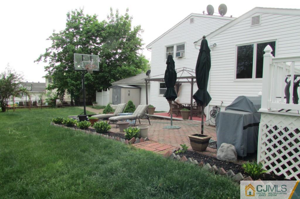 17 Gage Road East Brunswick, NJ 08816 - Photo 13 of 24 a front view of house with a garden and patio