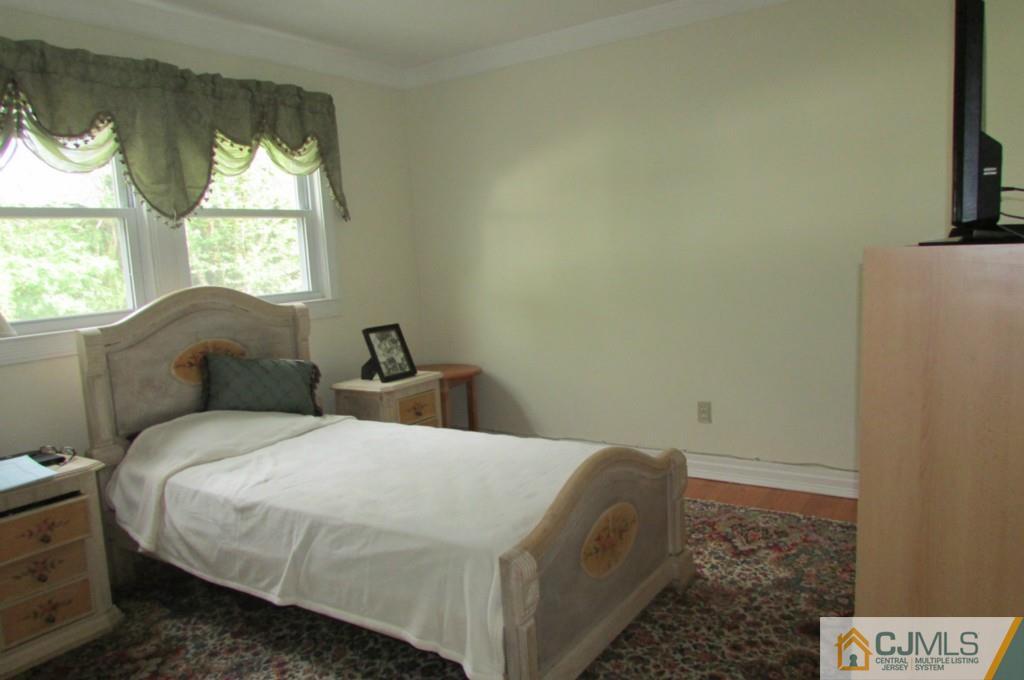 17 Gage Road East Brunswick, NJ 08816 - Photo 23 of 24 a bedroom with a bed and a window