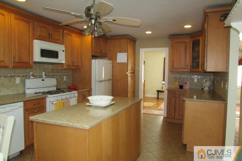 17 Gage Road East Brunswick, NJ 08816 - Photo 5 of 24 a kitchen with a sink appliances and cabinets