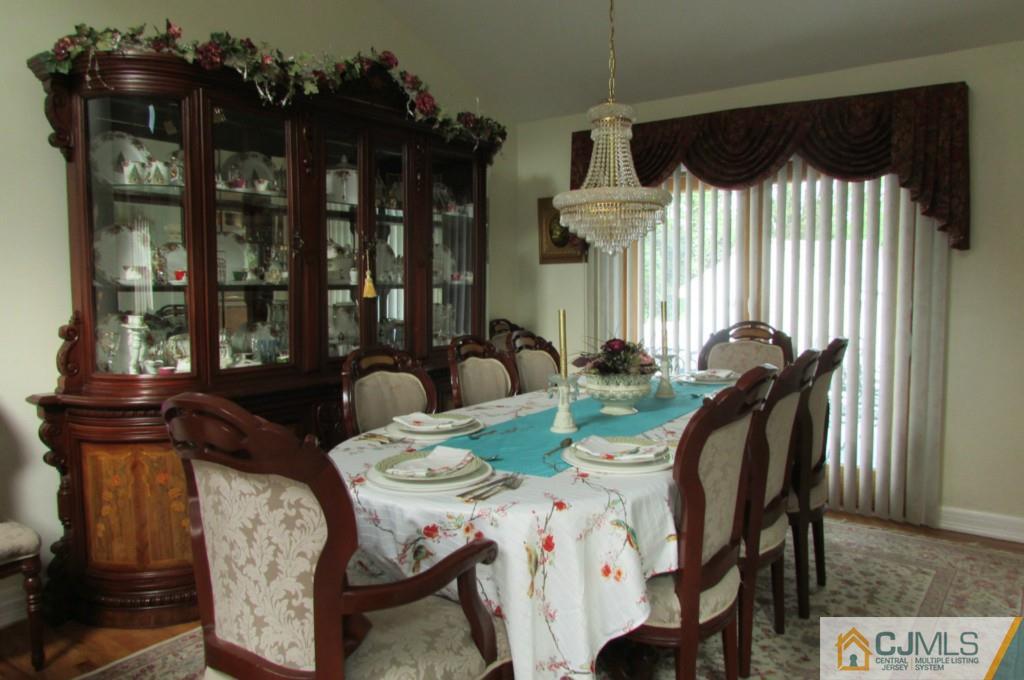 17 Gage Road East Brunswick, NJ 08816 - Photo 6 of 24 a view of a dining room with furniture and chandelier