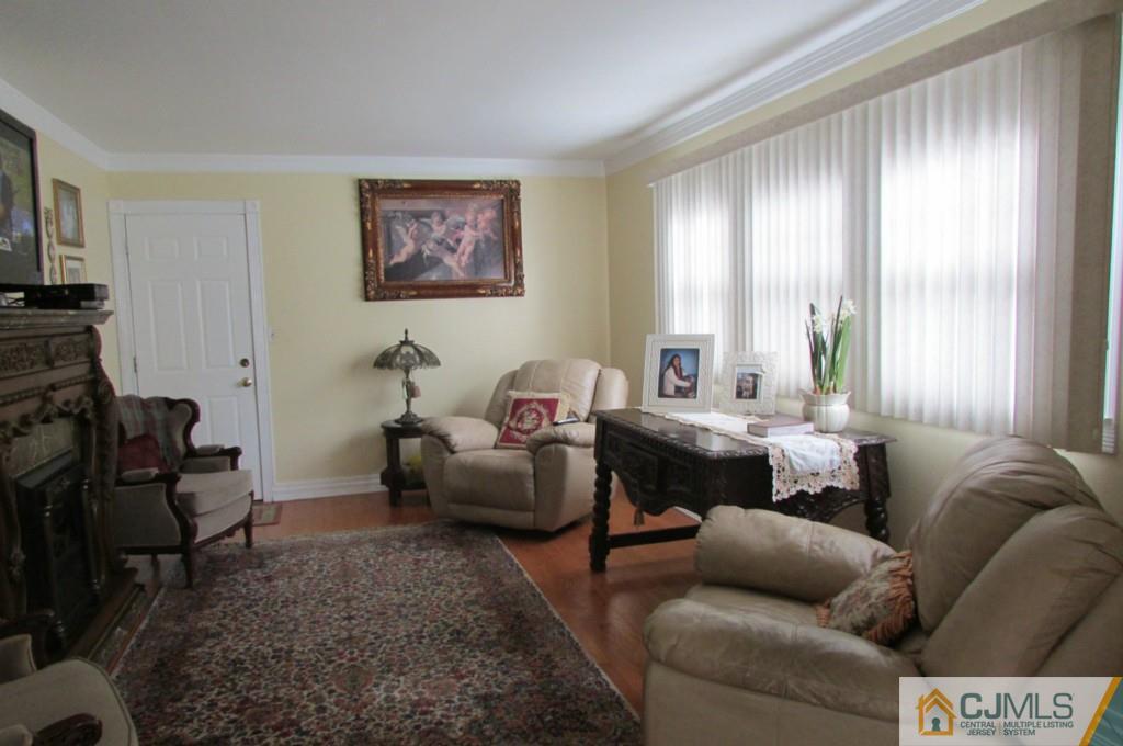 17 Gage Road East Brunswick, NJ 08816 - Photo 8 of 24 a living room with furniture and a window