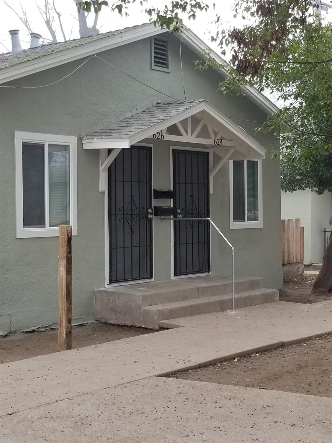 a front view of a house with a garage