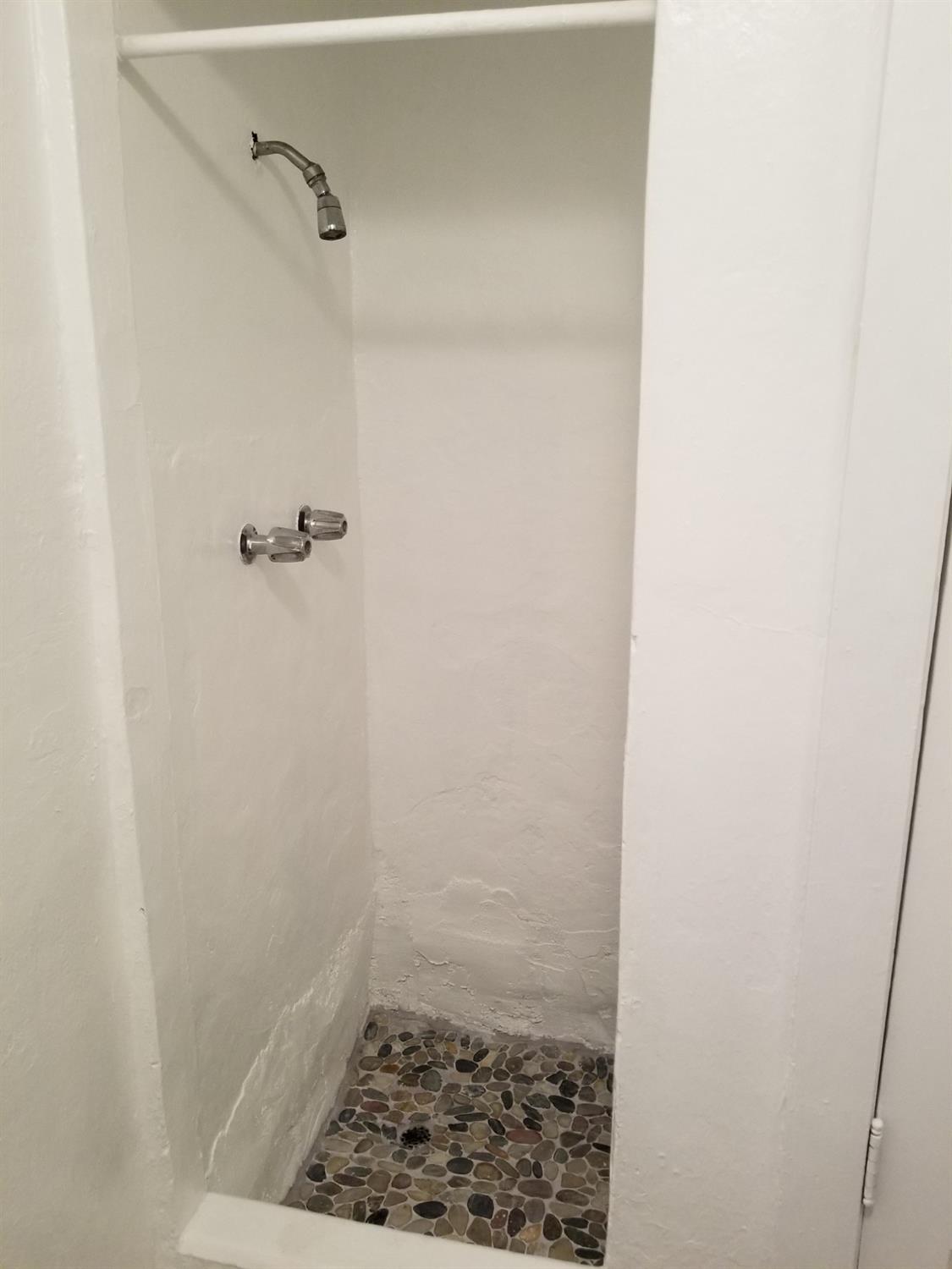 618 J Street Modesto, CA 95354 - Photo 14 of 38 a bathroom with a shower