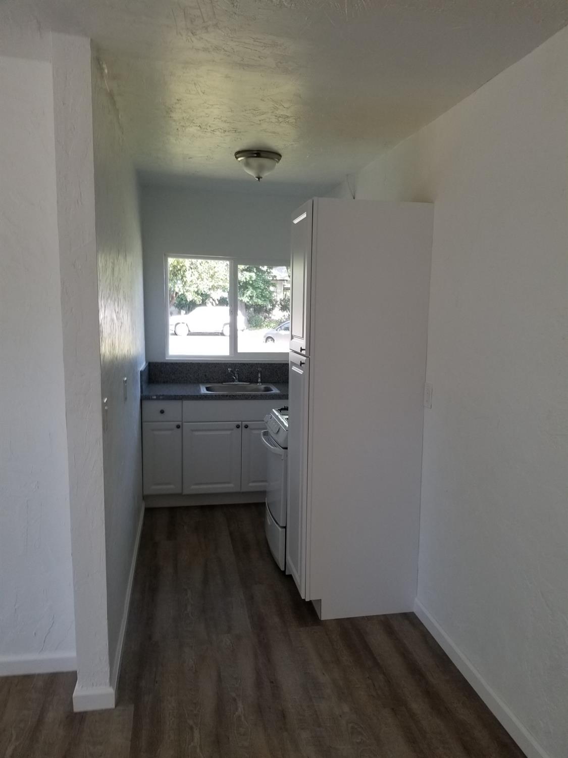 618 J Street Modesto, CA 95354 - Photo 17 of 38 a kitchen with sink and window