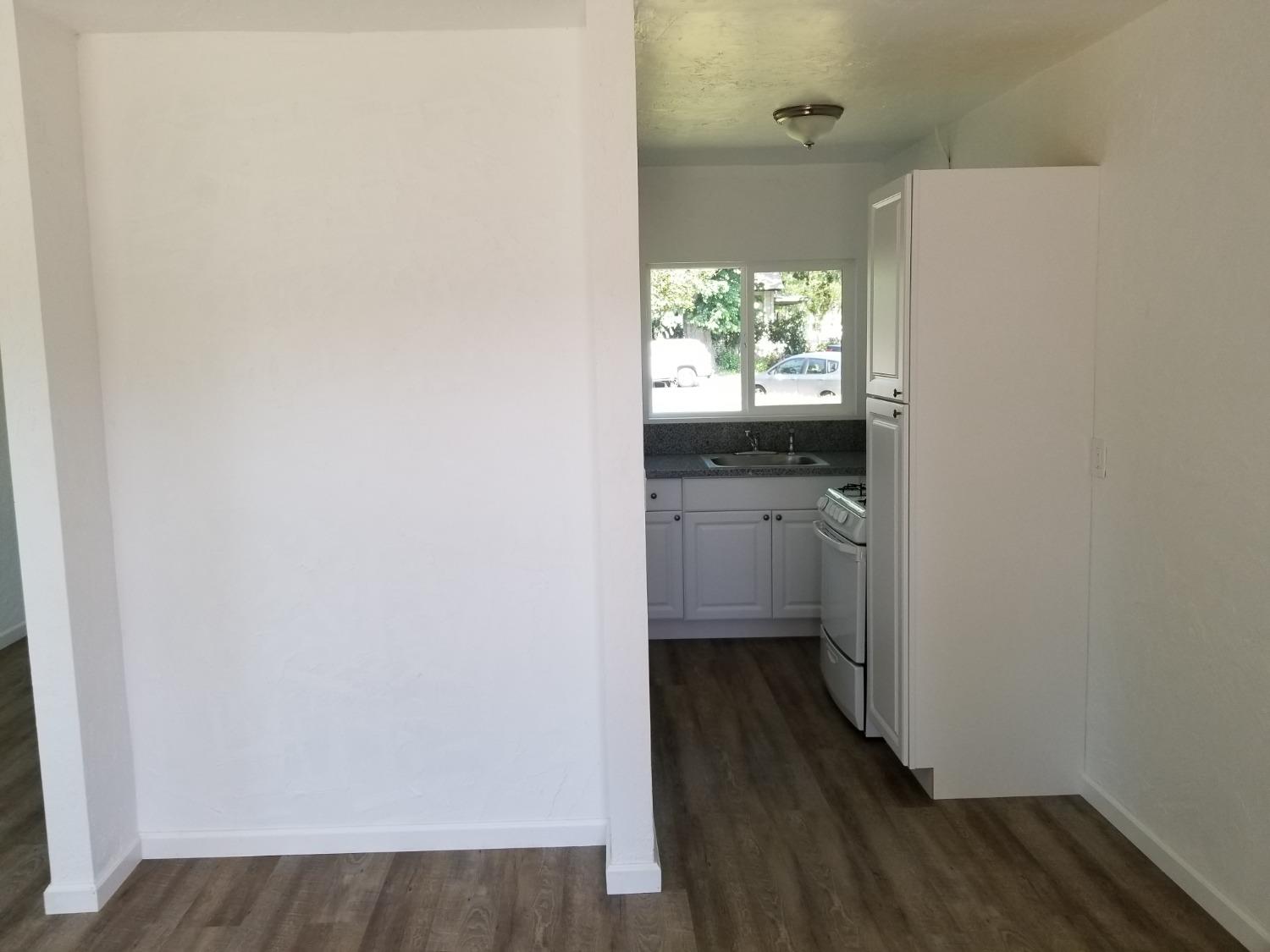 618 J Street Modesto, CA 95354 - Photo 23 of 38 a bathroom with a sink and a window