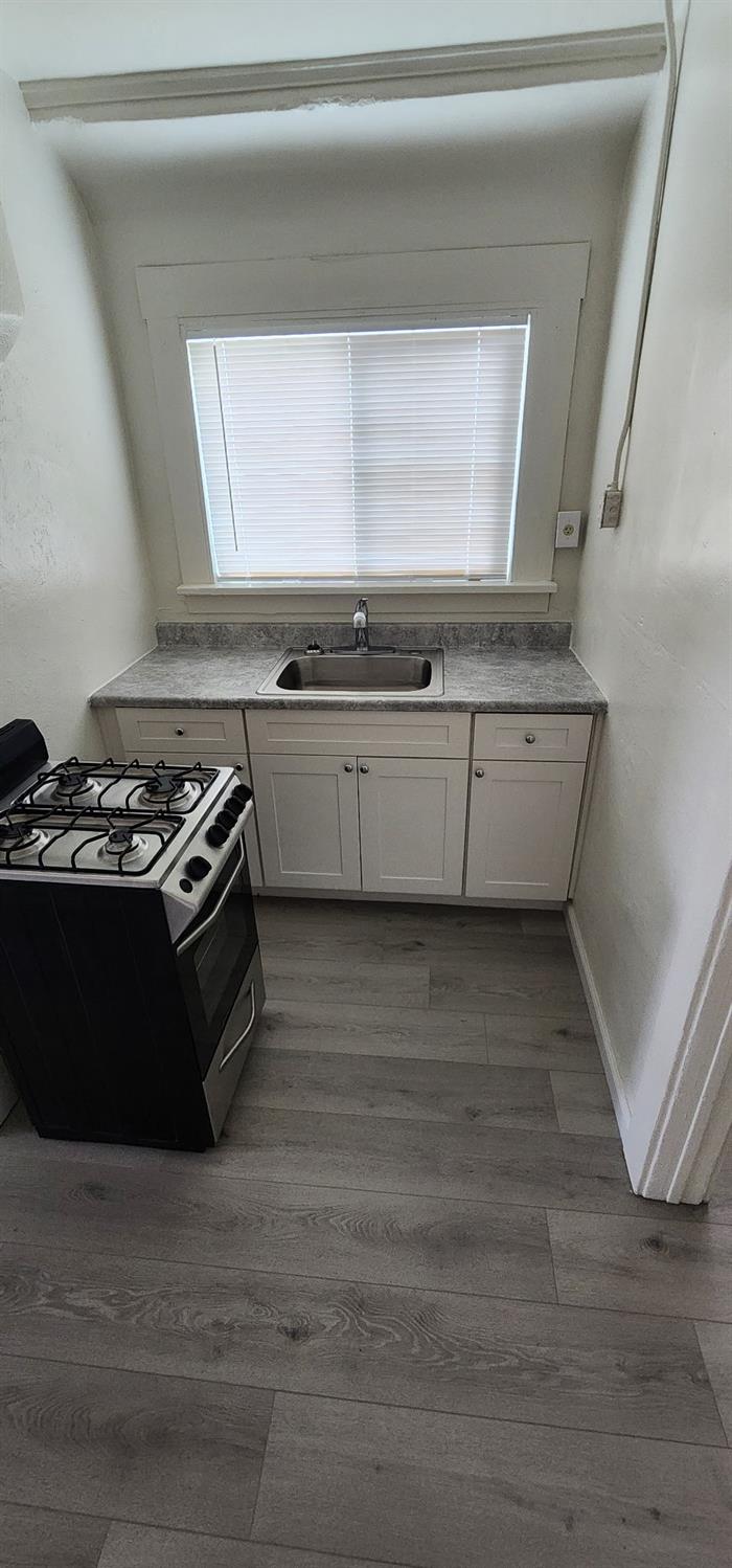 618 J Street Modesto, CA 95354 - Photo 35 of 38 a kitchen with a stove and a microwave