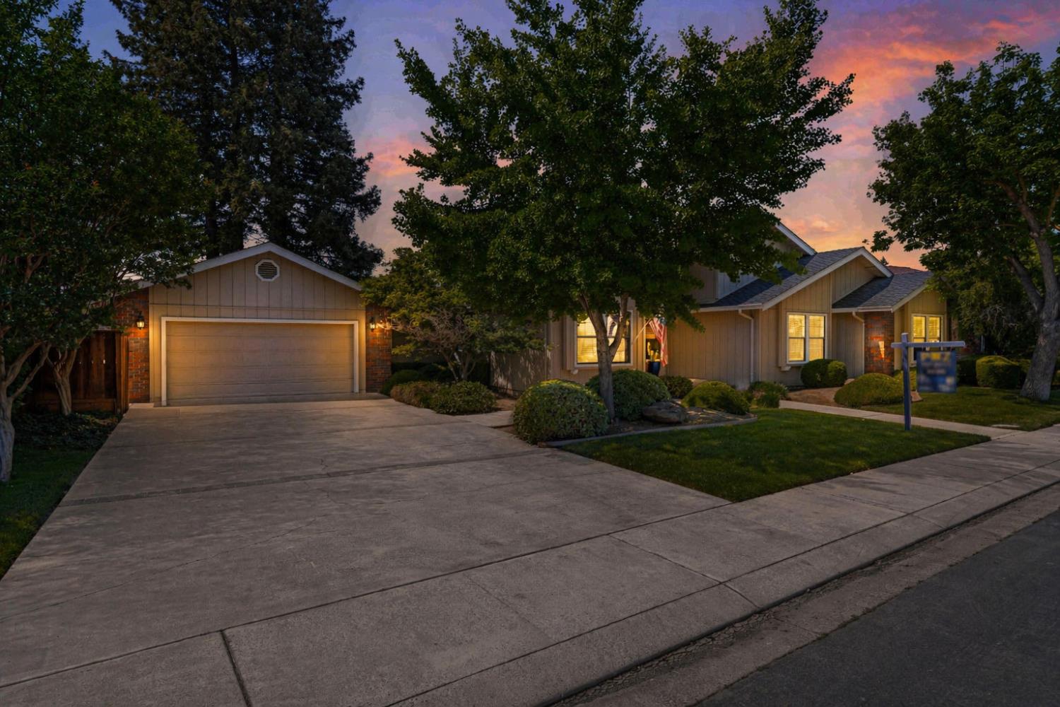 3829 Mondrian Drive Modesto, CA 95356 - Photo 2 of 37 a front view of a house with a yard and a garage