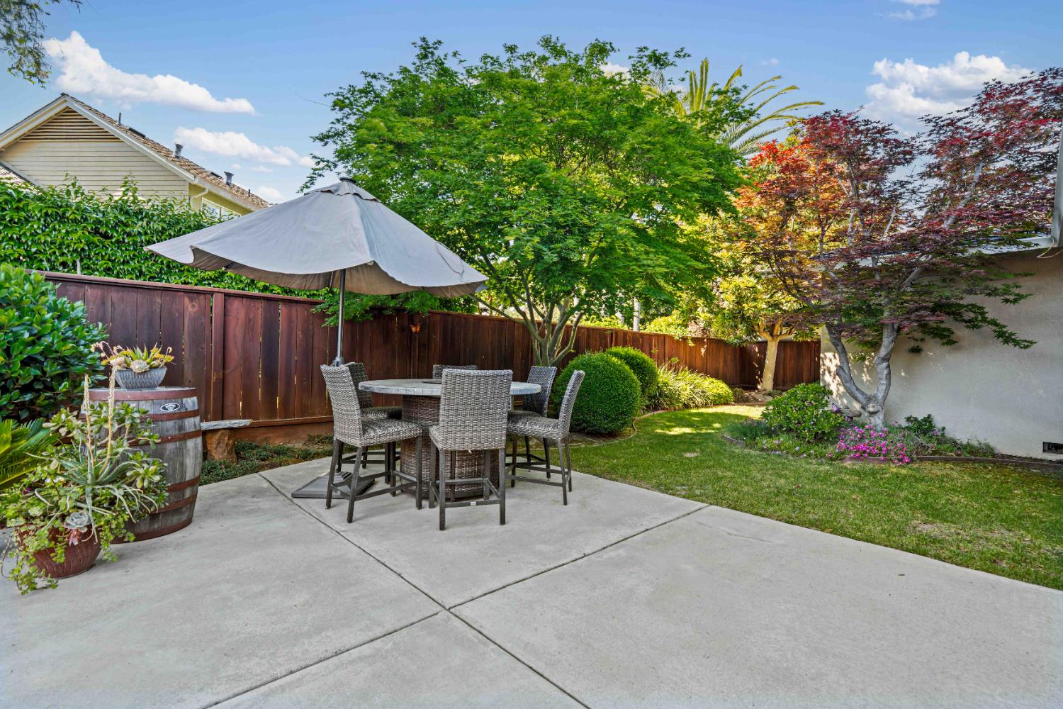 3829 Mondrian Drive Modesto, CA 95356 - Photo 31 of 37 a view of a patio with table and chairs under an umbrella