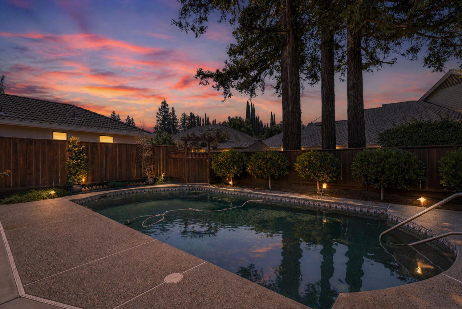 3829 Mondrian Drive Modesto, CA 95356 - Photo 4 of 37 a backyard of a house with lots of green space and fountain