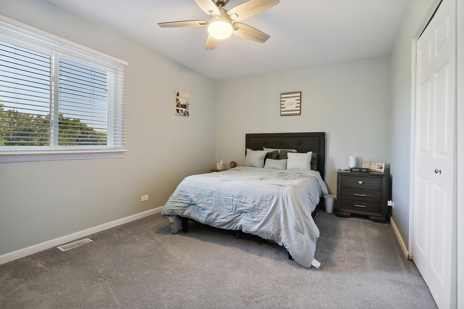 5702 Crestwood Road Matteson, IL 60443 - Photo 9 of 16 a bedroom with a bed and window