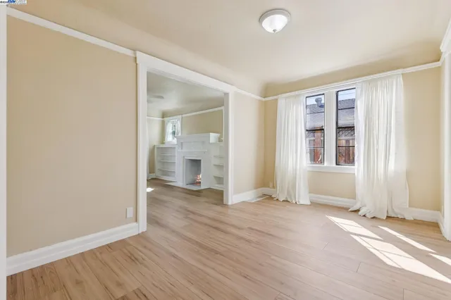 a kitchen with stainless steel appliances white cabinets and a stove top oven