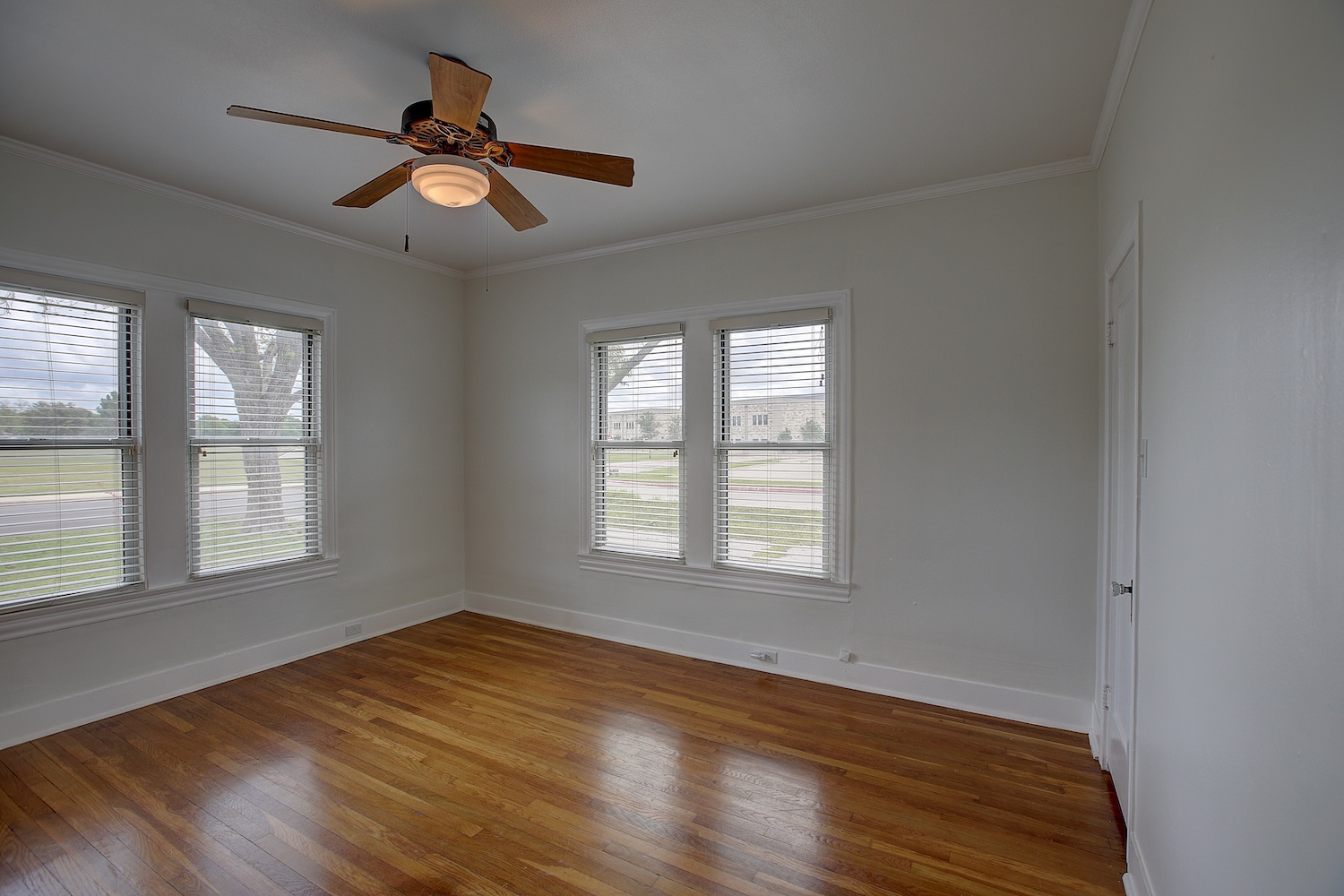 1708 Olive Street Georgetown, TX 78626 - Photo 20 of 40 an empty room with wooden floor fan and windows