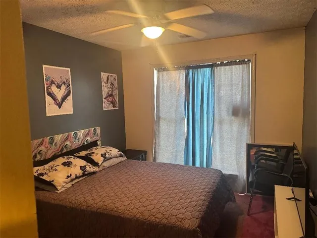 a bedroom with a bed and a cabinets