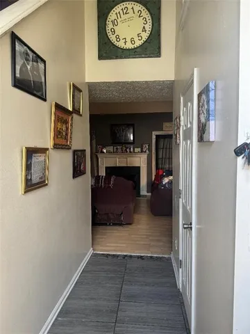 a view of living room and wooden floor