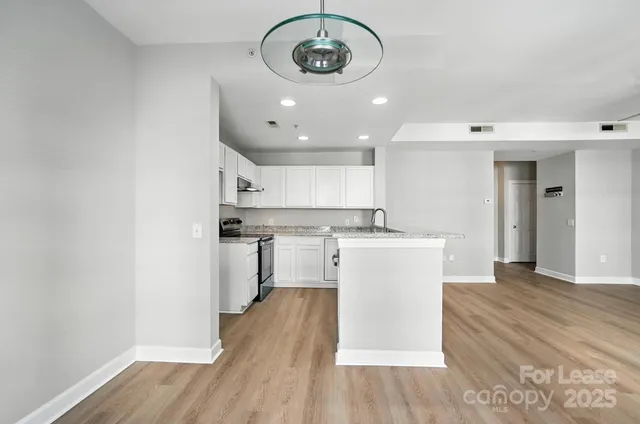 a view of a kitchen with a sink and dishwasher