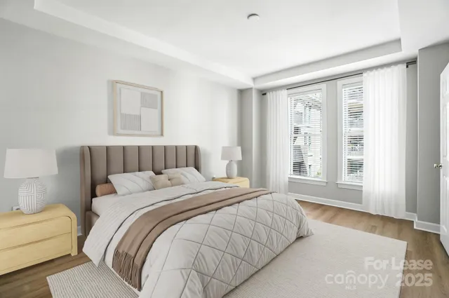 a bedroom with a large bed and a couch