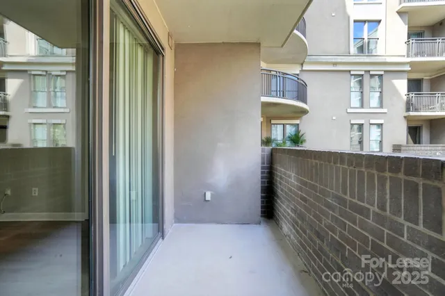 a view of a brick house with many windows