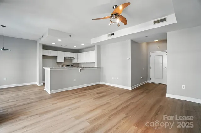 a view of kitchen with wooden floor and window